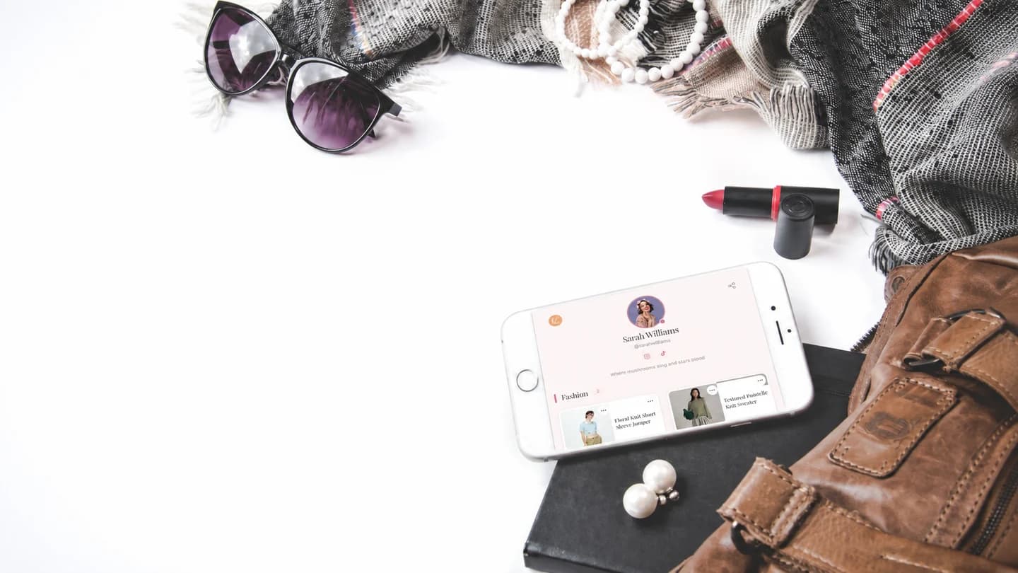 Fashion accessories flat lay edited to show the Lunera profile on the phone screen